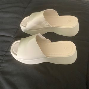 Platform slides in cream color.